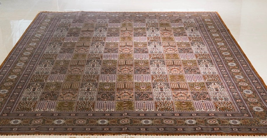 Image of a handmade silk carpet, made in  qum
